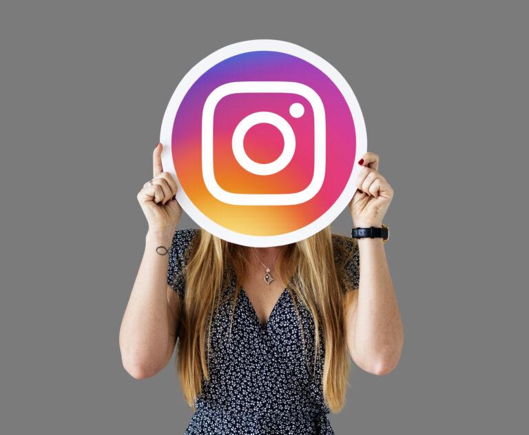 woman showing instagram icon