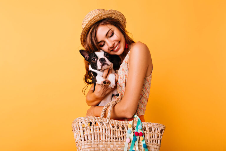 red haired white girl posing studio with her pet good looking young lady hat holding french bulldog bright