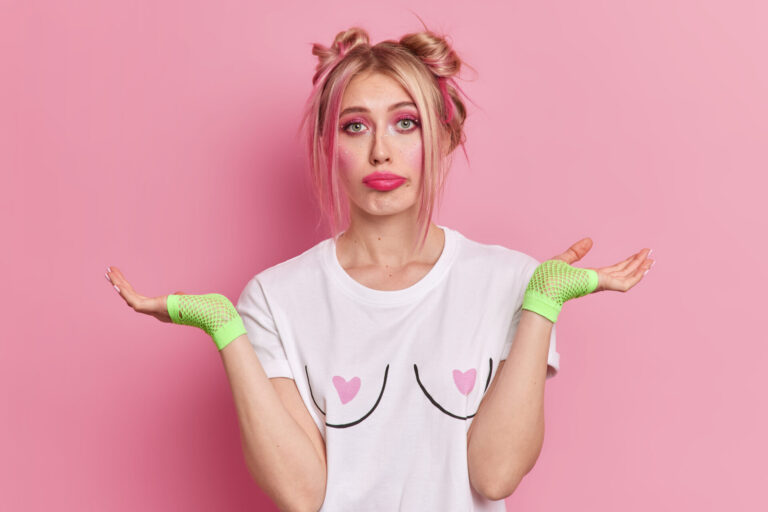 clueless blonde young pretty woman spreads palms feels hesitant doesnt know answer makes choice